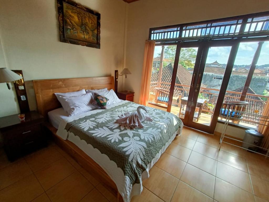 Postel nebo postele na pokoji v ubytování wahyu accomodation