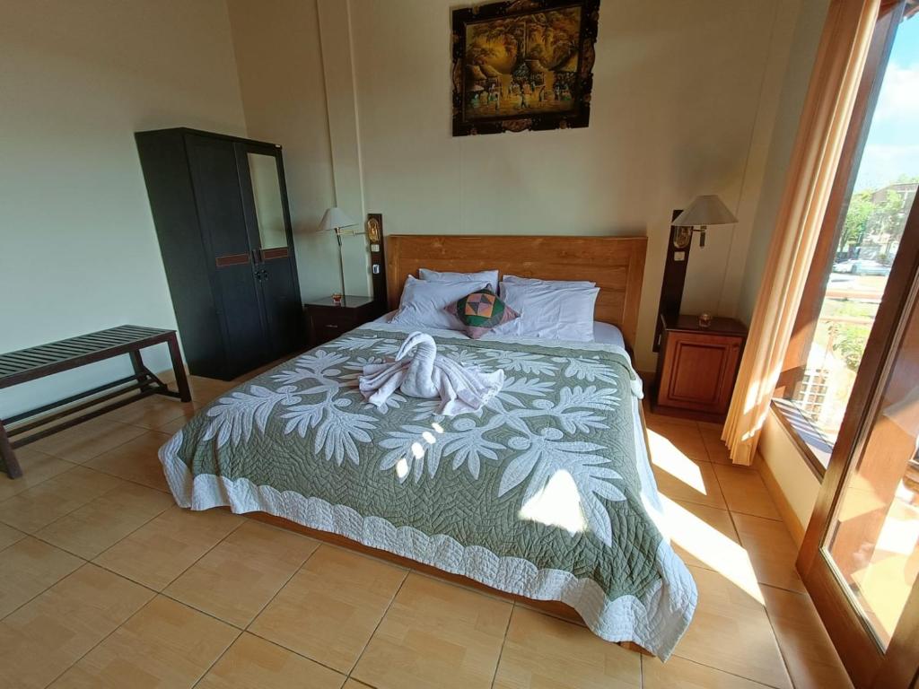Postel nebo postele na pokoji v ubytování wahyu accomodation