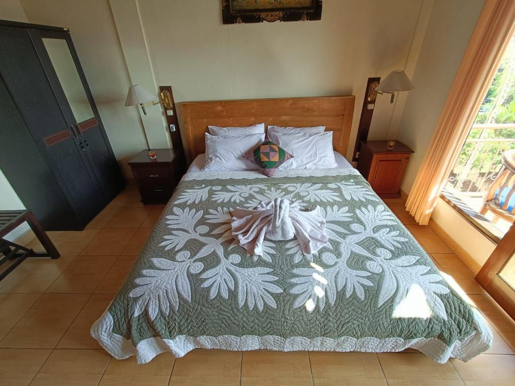 Postel nebo postele na pokoji v ubytování wahyu accomodation