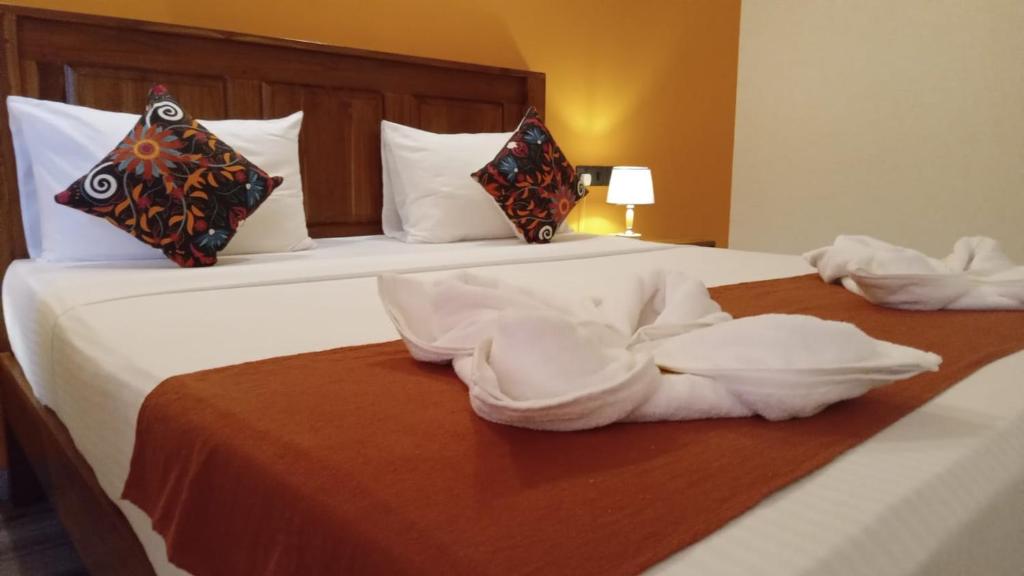 Postel nebo postele na pokoji v ubytování Ali Weta Safari Resort