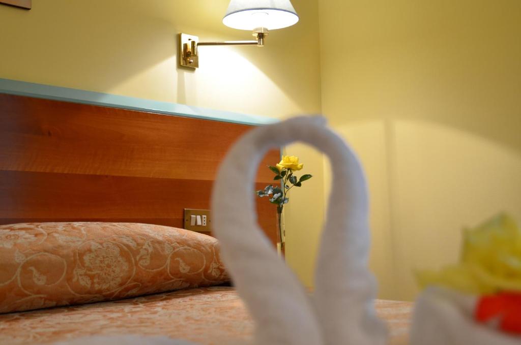 Posteľ alebo postele v izbe v ubytovaní Hotel Parco degli Ulivi