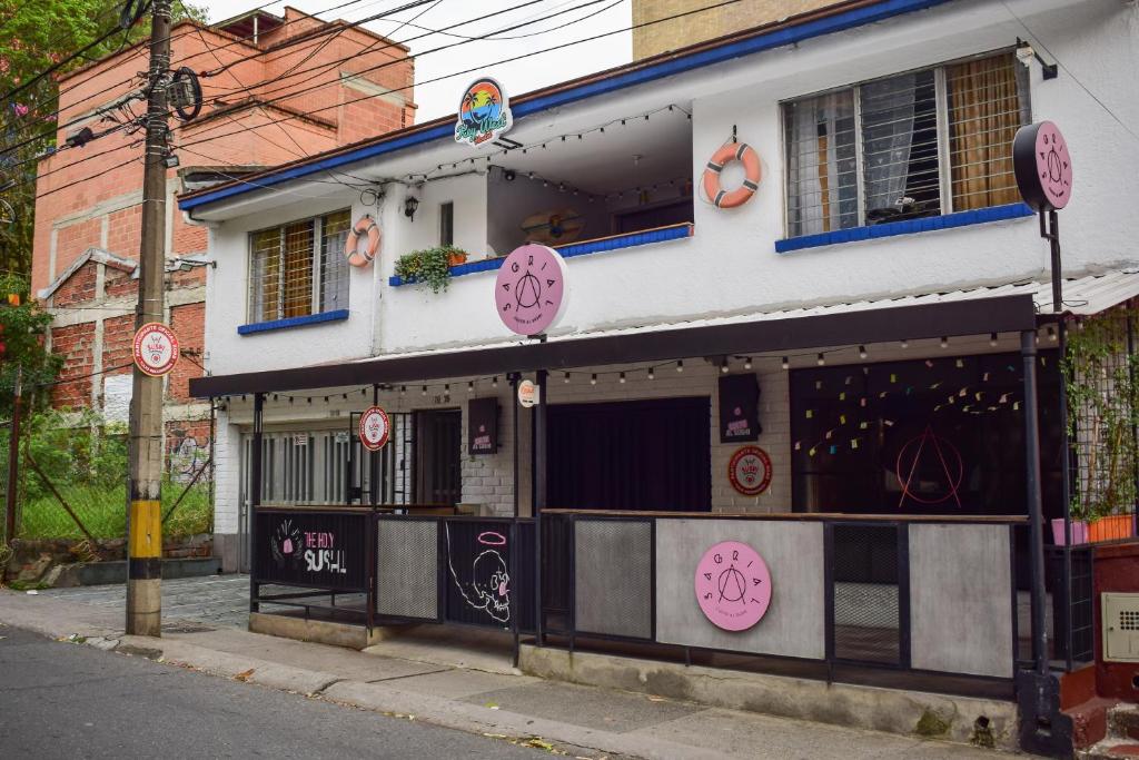 a building with hello kitty signs on the side of it at KEY WEST HOSTEL in Medellín
