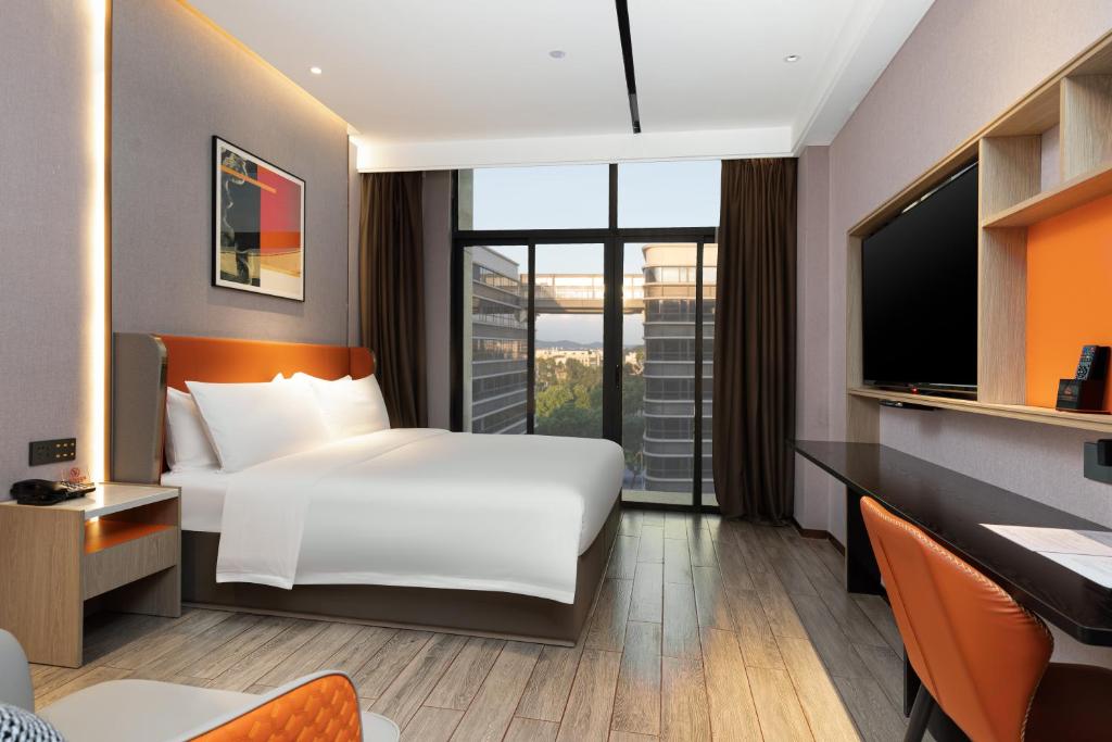 Postel nebo postele na pokoji v ubytování Guangzhou Yunjia Hotel - Airport Terminal 2