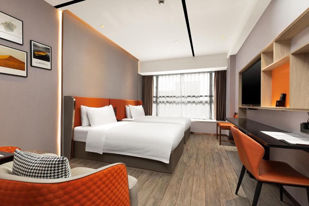 Postel nebo postele na pokoji v ubytování Guangzhou Yunjia Hotel - Airport Terminal 2