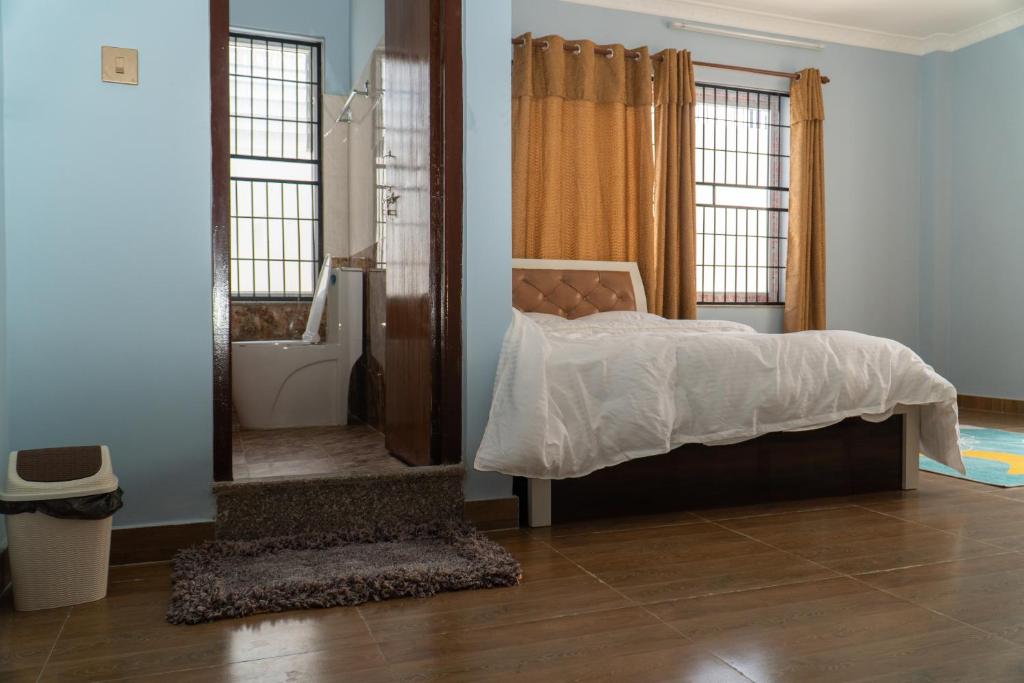 The White House Villa 8 bedroom with Swimming Pool tesisinde bir odada yatak veya yataklar