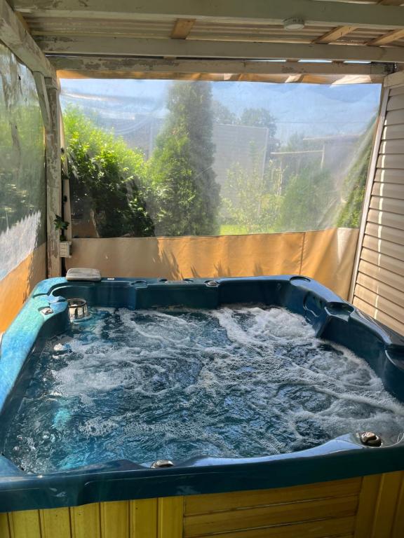 a large jacuzzi tub in a backyard at Shabla Lux Guest Houses in Shabla