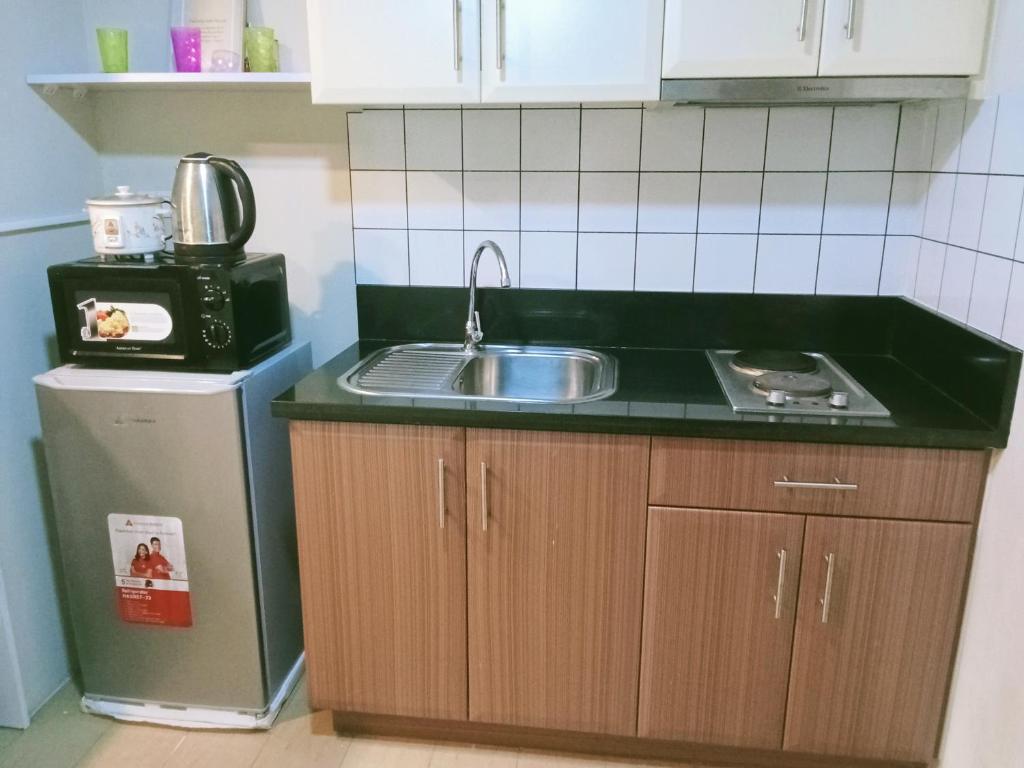 Kuchyň nebo kuchyňský kout v ubytování Henry's Newport Condotel