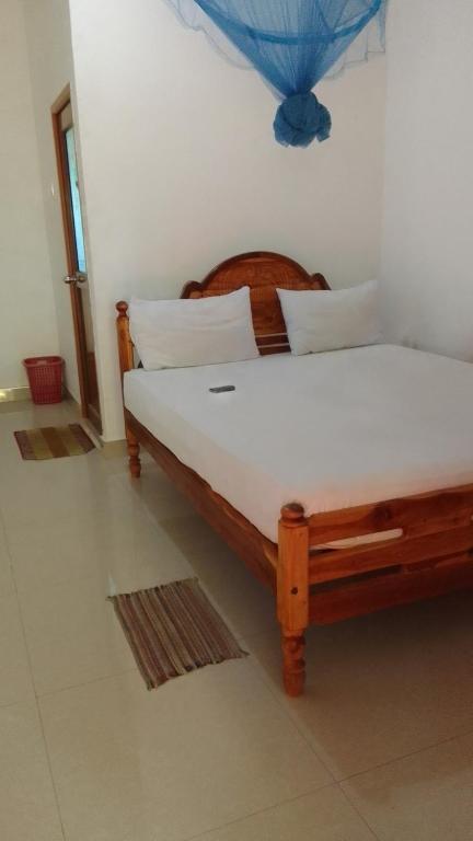 Postel nebo postele na pokoji v ubytování Pranu House