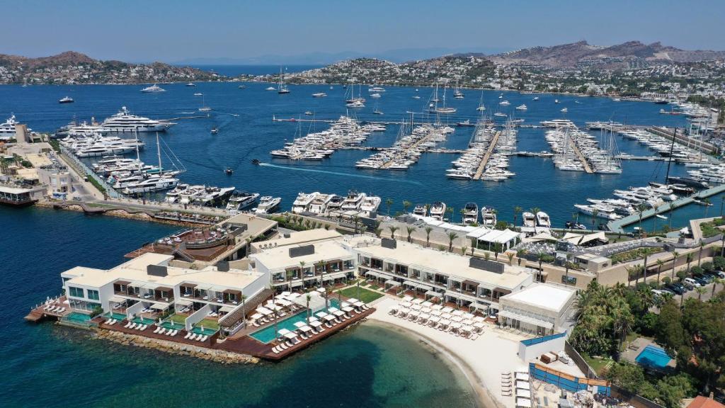 an aerial view of a marina with boats in the water at Yalikavak Marina Hotel By Social Living Collection in Yalıkavak