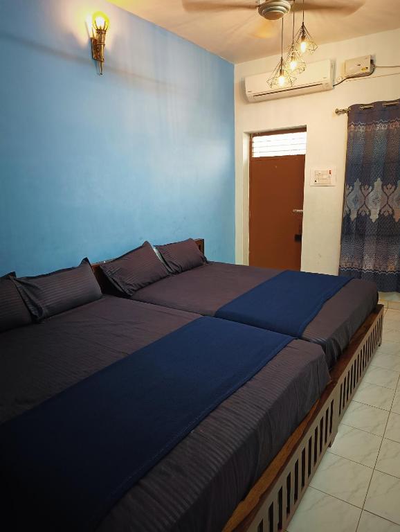 Voodi või voodid majutusasutuse Omkara - The Fives Guest house toas