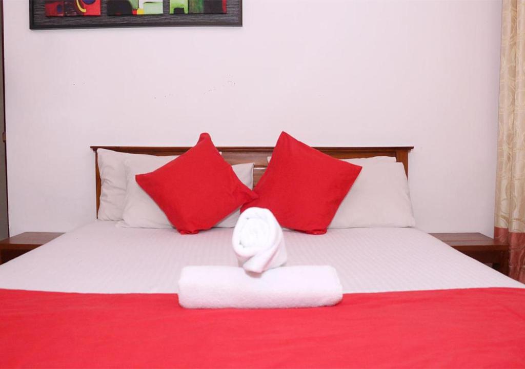 Postel nebo postele na pokoji v ubytování Cozy Inn Negombo