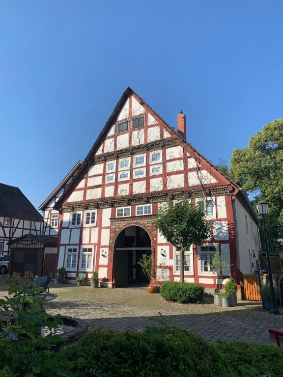 an old building with a red and white at Haus der Begegnung in Schieder-Schwalenberg