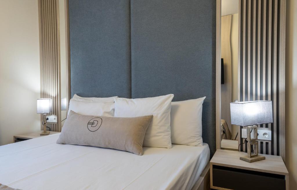 Postel nebo postele na pokoji v ubytování Dulamerovic Hotel