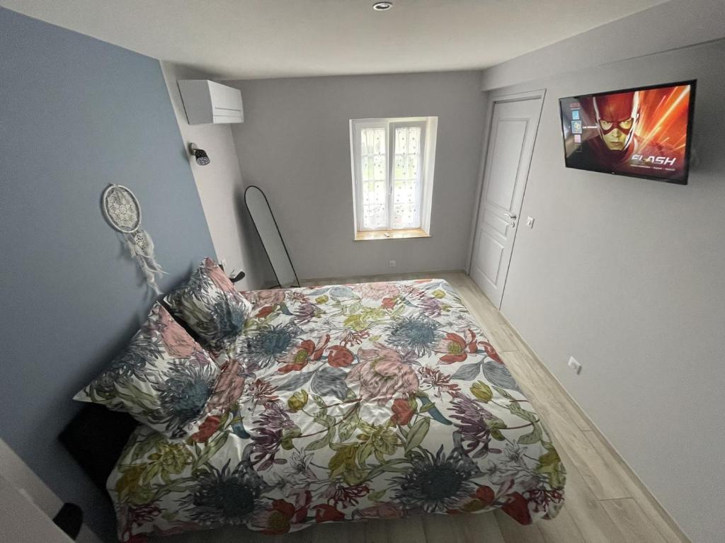Postel nebo postele na pokoji v ubytování Les mimosas
