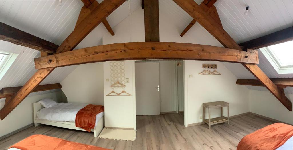 Postel nebo postele na pokoji v ubytování Lodge Vent d’Ouest