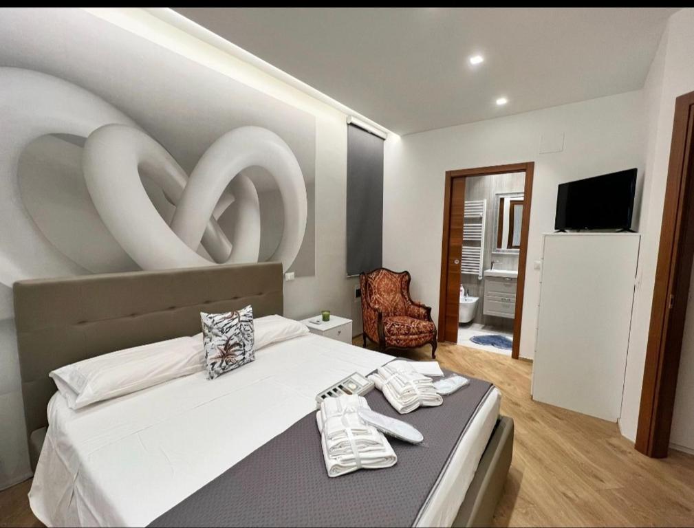 Un pat sau paturi într-o cameră la La Villetta sul Mare