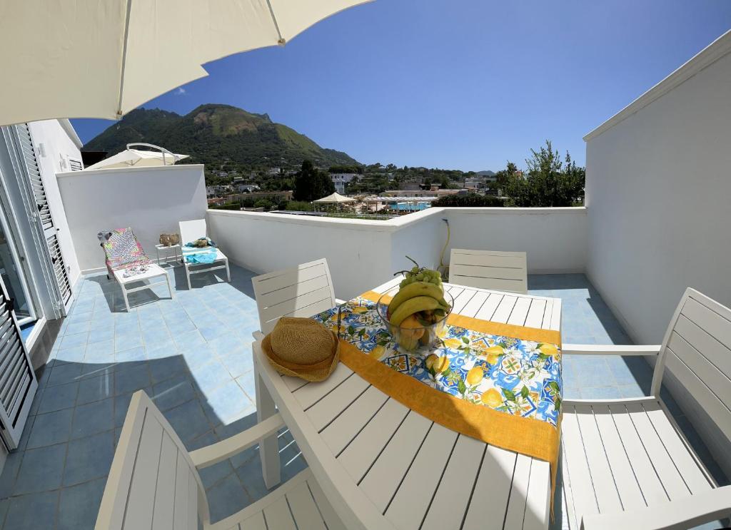 a stuffed dog in a bed on a balcony at Bellessere in vacanza Forio d’ Ischia in Forio d'Ischia