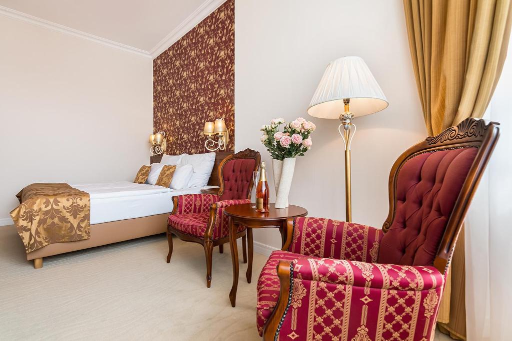 Postel nebo postele na pokoji v ubytování Hotel Katerina