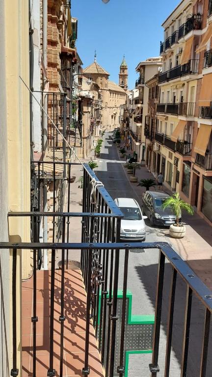 a view of a city street from a balcony at Piso en el Centro de Antequera in Antequera