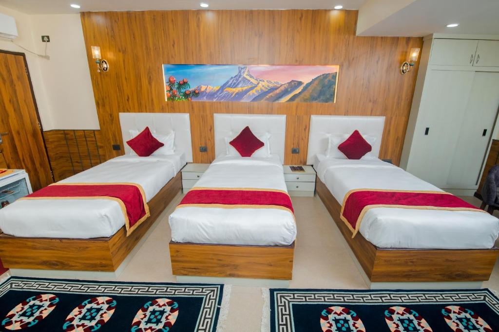 Postel nebo postele na pokoji v ubytování Hotel Palazzo