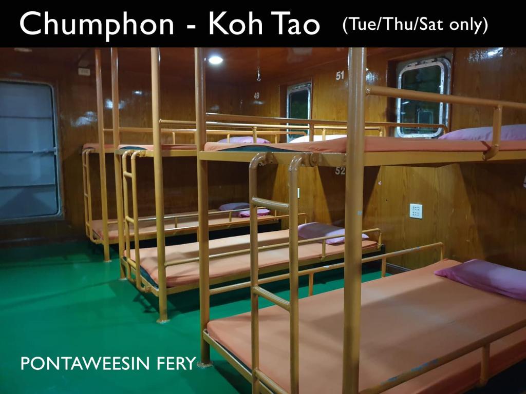 a group of bunk beds on a boat at Chumphon - Koh Tao Night Ferry in Chumphon