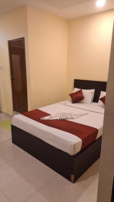 Postel nebo postele na pokoji v ubytování VRS Residency