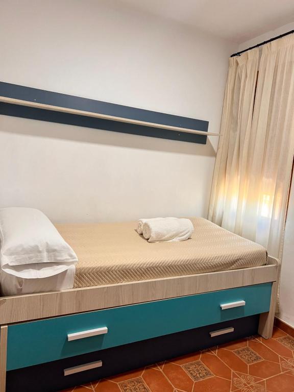 Posteľ alebo postele v izbe v ubytovaní APARTAMENTO LA MURALLA 2