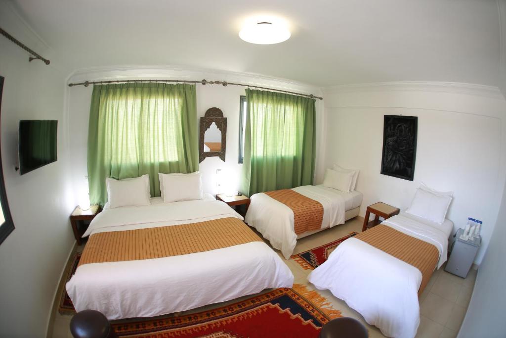 Postel nebo postele na pokoji v ubytování Rose Valley Hotel
