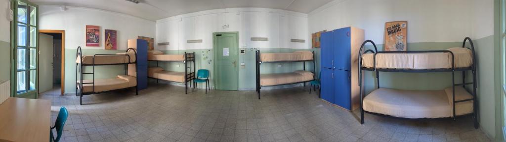 Postel nebo postele na pokoji v ubytování Litus Roma Hostel