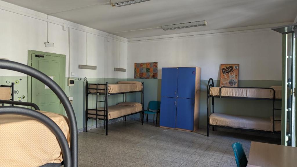 Postel nebo postele na pokoji v ubytování Litus Roma Hostel