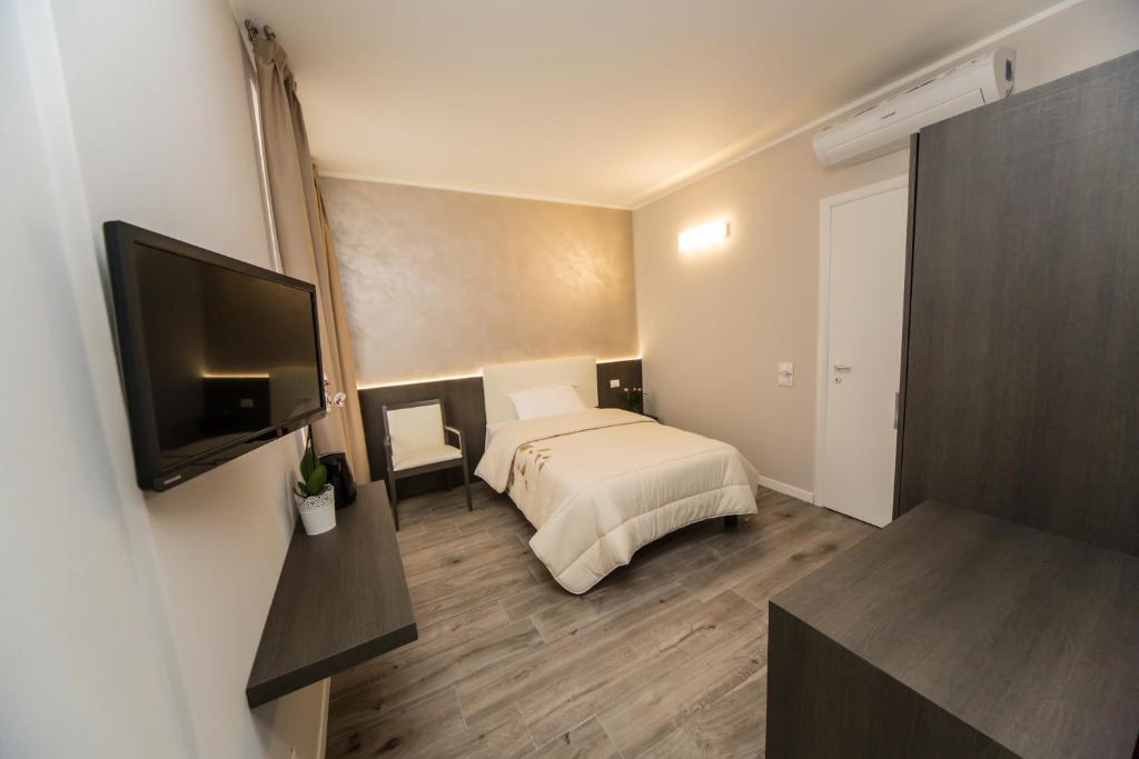 TV a/nebo společenská místnost v ubytování B&B Corte sul Naviglio CIN I T 0 1 5 0 7 0 C 1 3 X U I L Q C V