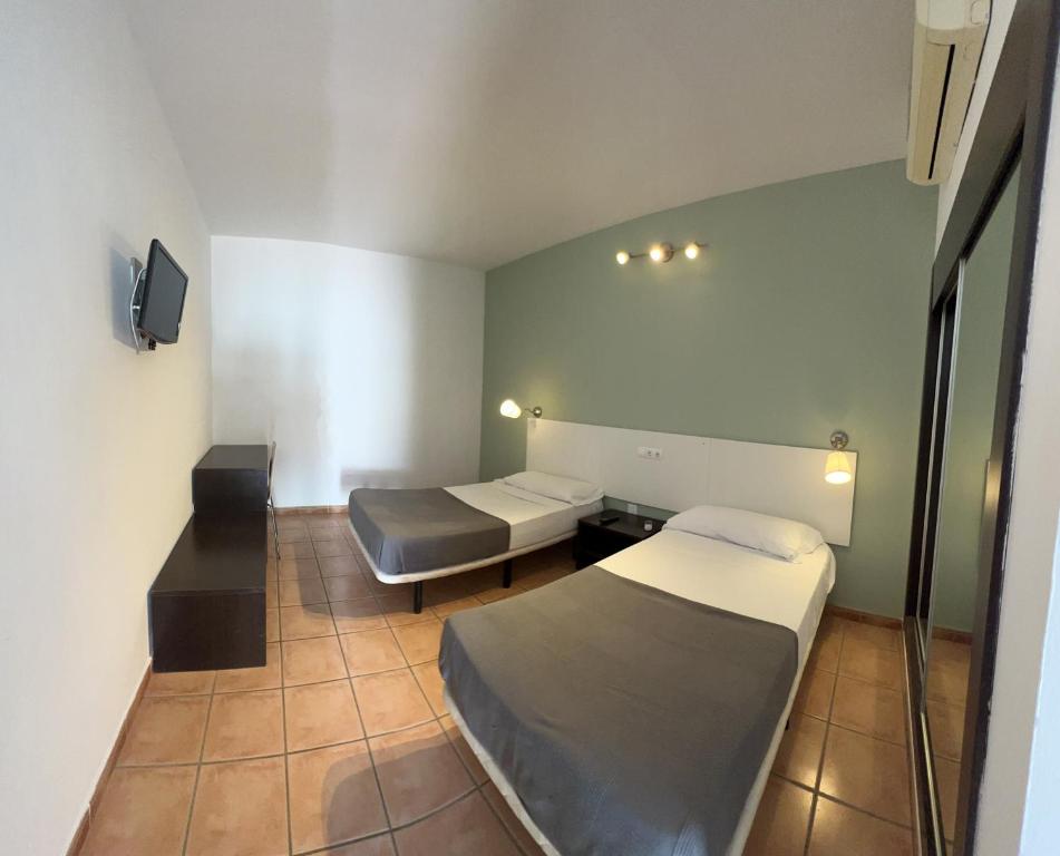 Ένα ή περισσότερα κρεβάτια σε δωμάτιο στο #3 HABITACION DOBLE AYAMONTE