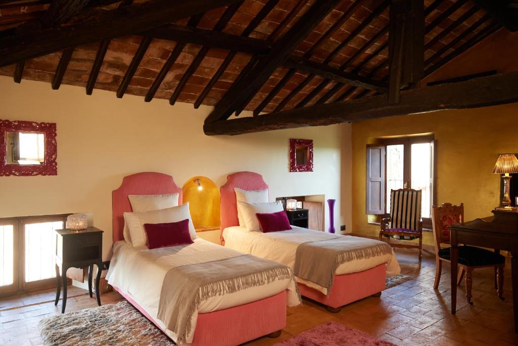 Postel nebo postele na pokoji v ubytování Palazzo storico Colesanti