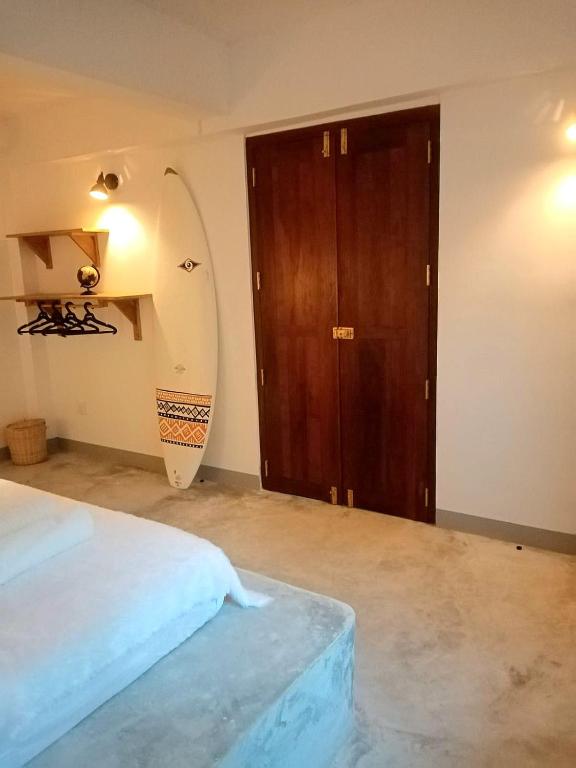 Postel nebo postele na pokoji v ubytování Sri Lanka Surf Villa Domus Graziella
