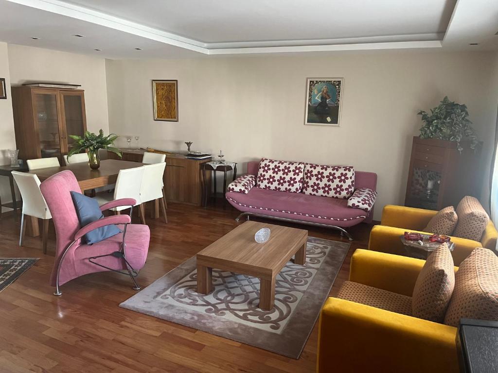 a living room with couches and chairs and a table at Best site in İstanbul (3+1) Central&Elite Zone in town in Istanbul