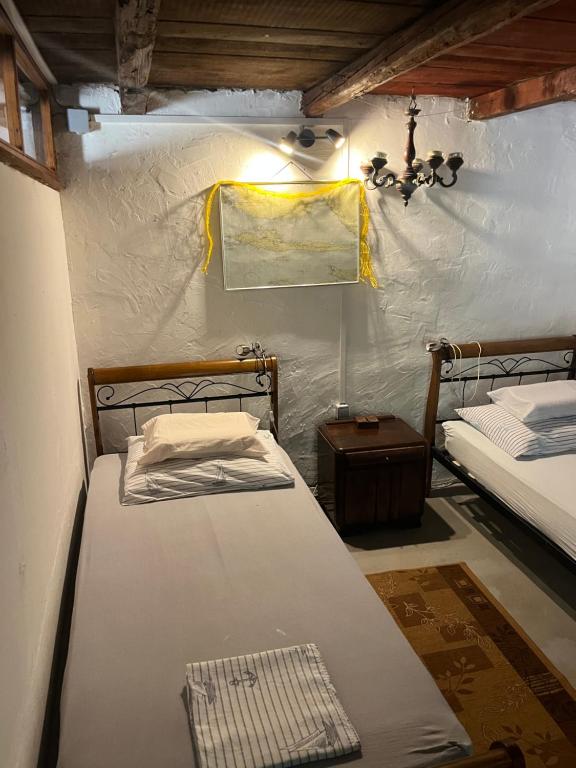 a room with two beds in a tent at Holiday home Stiniva in Vis