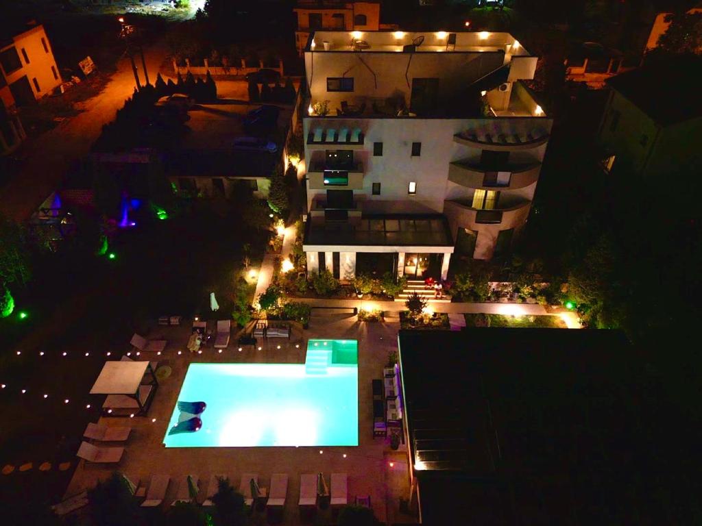 an overhead view of a swimming pool at night at Mamaia Moments Villa, Mamaia Nord in Mamaia Nord
