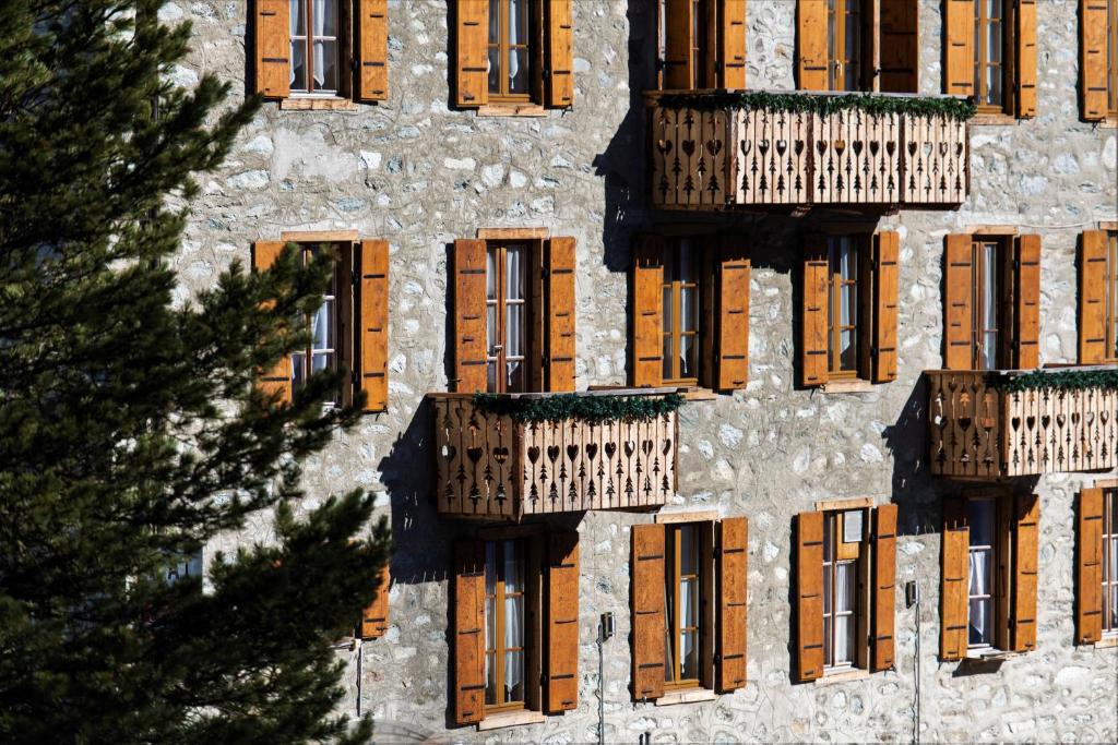 a building with balconies on the side of it at Aiguille de La Tza in Arolla