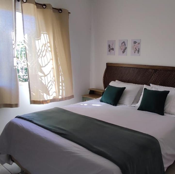 Katil atau katil-katil dalam bilik di Casa central aconchegante
