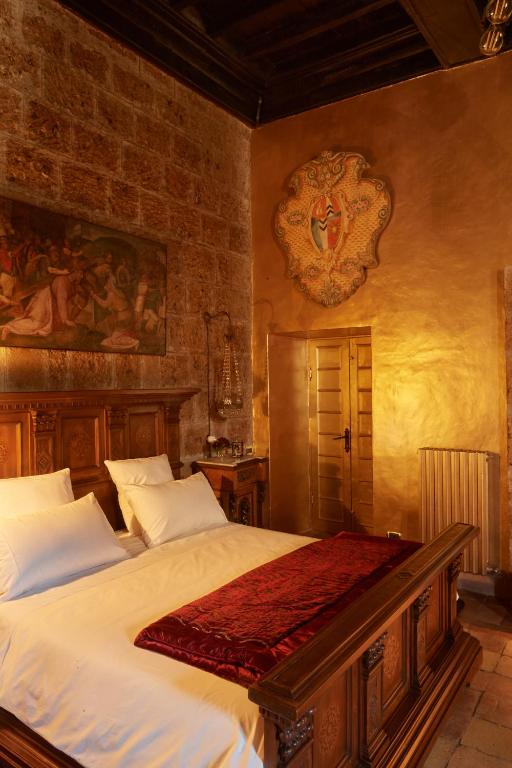 Postel nebo postele na pokoji v ubytování Palazzo storico Colesanti