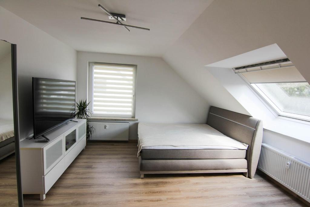 Llit o llits en una habitació de Appartement in Pattensen