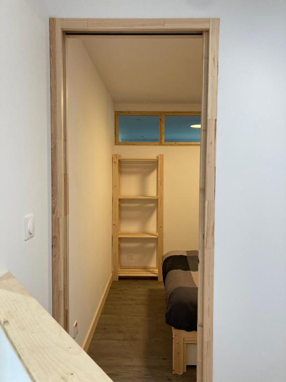 a small room with a closet and a bed at T2 Le Conquet &quot;Molène&quot; avec parking privé 300m commerces in Le Conquet