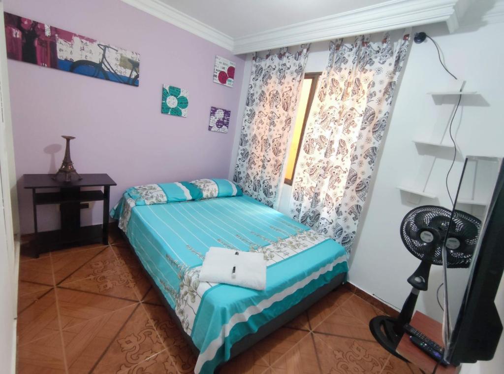 Postel nebo postele na pokoji v ubytování Hospedaje Casa Aurora