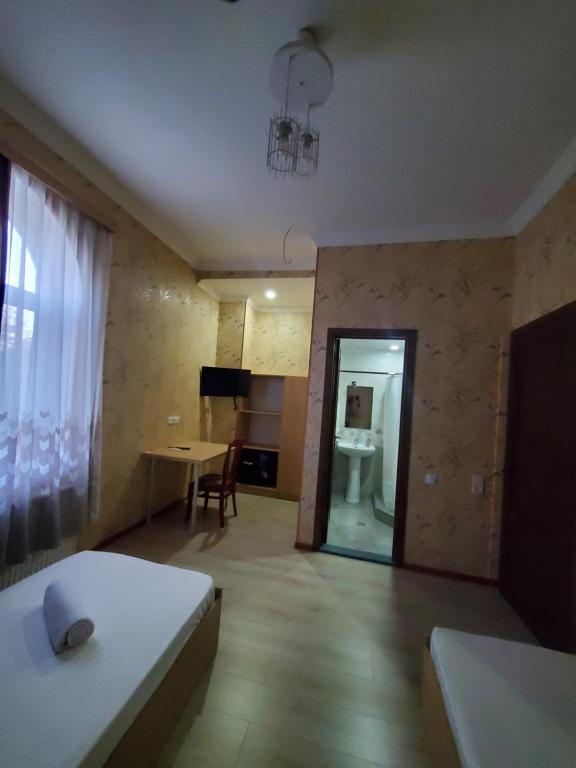 Postel nebo postele na pokoji v ubytování Gogi's Paradise Guesthouse
