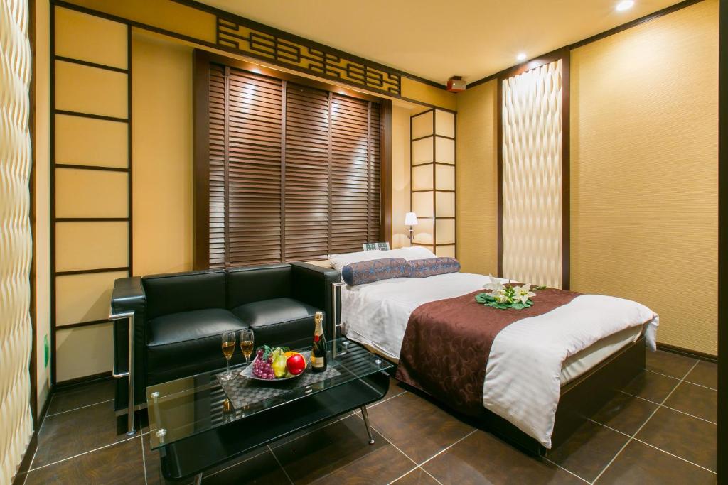 Postel nebo postele na pokoji v ubytování Hotel ELEMENT -エレメント-