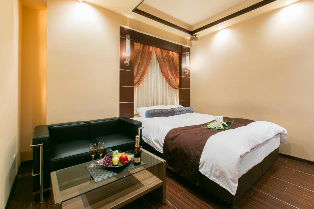 Postel nebo postele na pokoji v ubytování Hotel ELEMENT -エレメント-