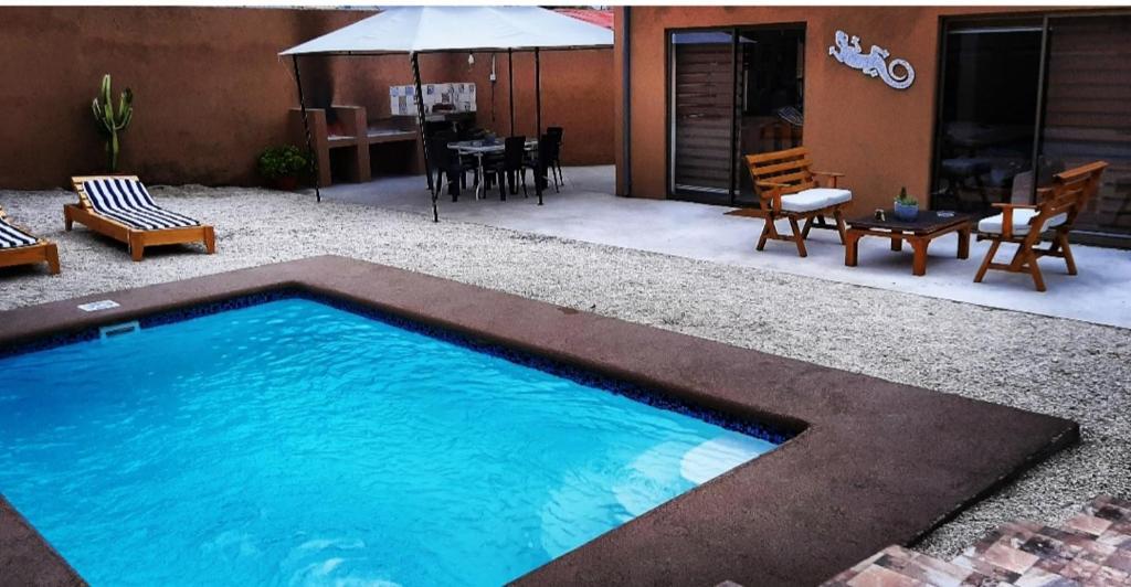 a swimming pool in the middle of a yard at Casa Balmaceda Paihuano in Paihuano