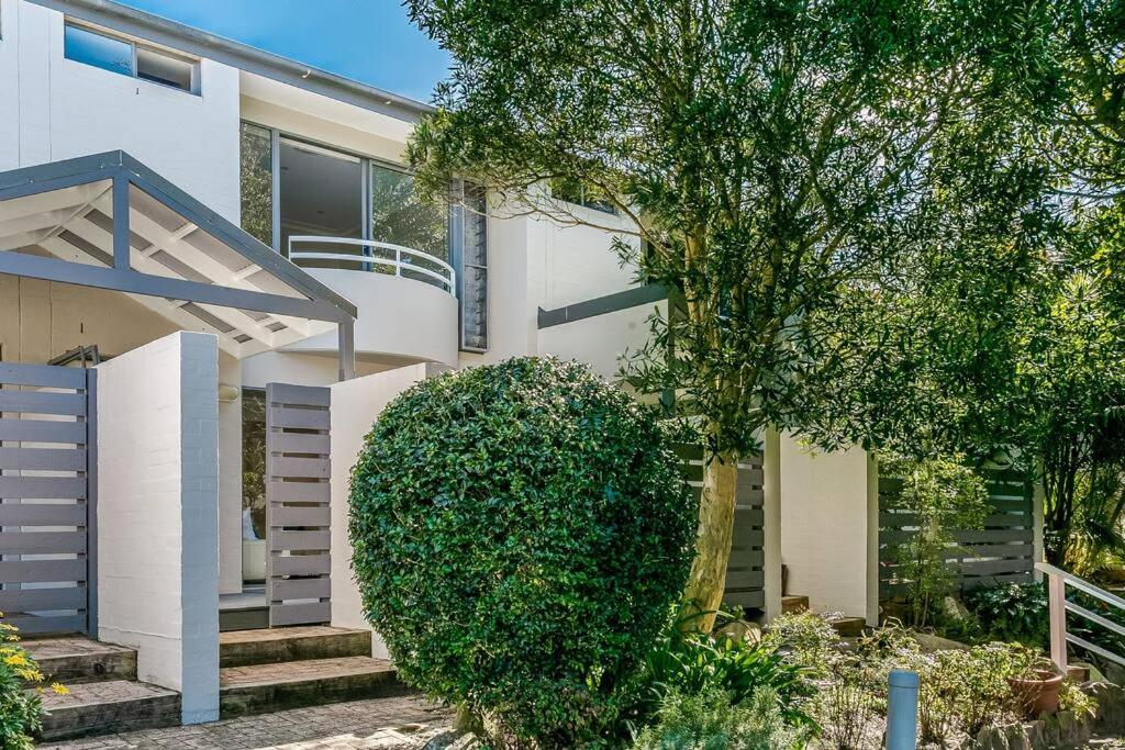 a house with a large bush in front of it at DY008 - 3 bedroom townhouse - Dee Why in Sydney