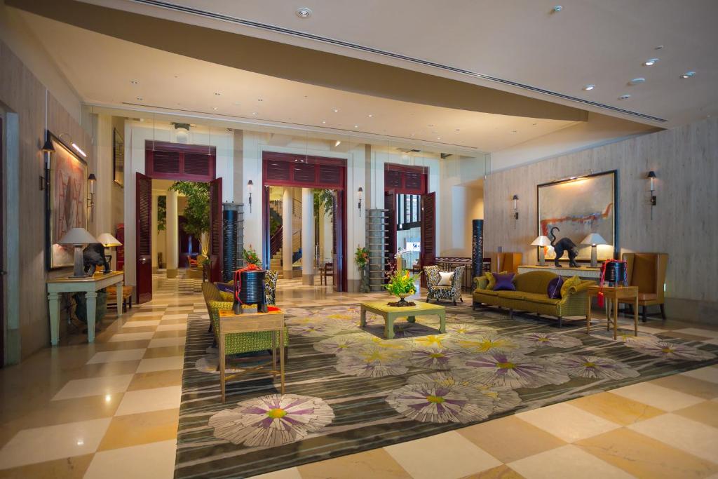 a living room with couches and tables in a building at Hotel Nikko Kanazawa in Kanazawa