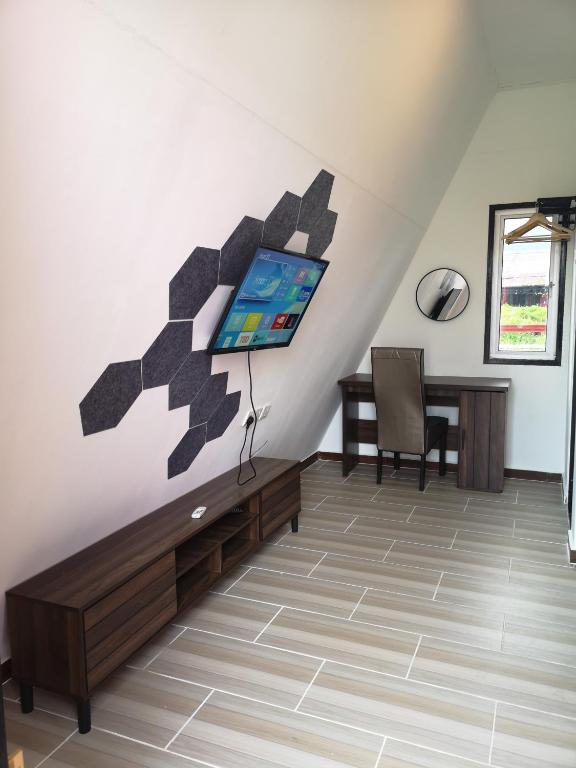 Posezení v ubytování Red Triangle Cottage Roomstay